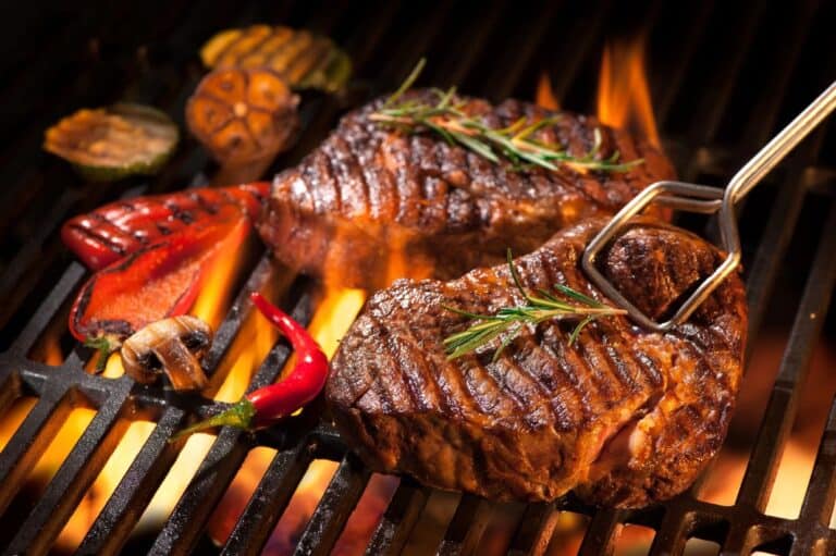 Beef steaks on the grill.