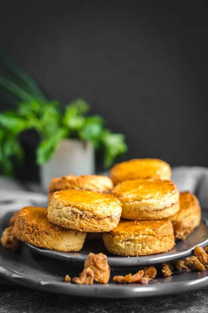 Fluffy sour cream biscuits on a plate.