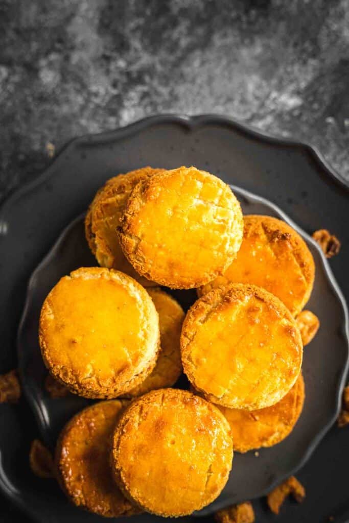 Fluffy sour cream biscuits on a plate.