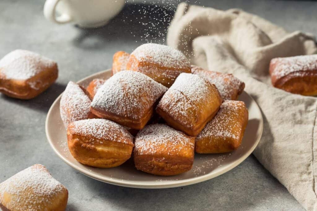 Homemade New Orleans french beignets with powdered sugar.