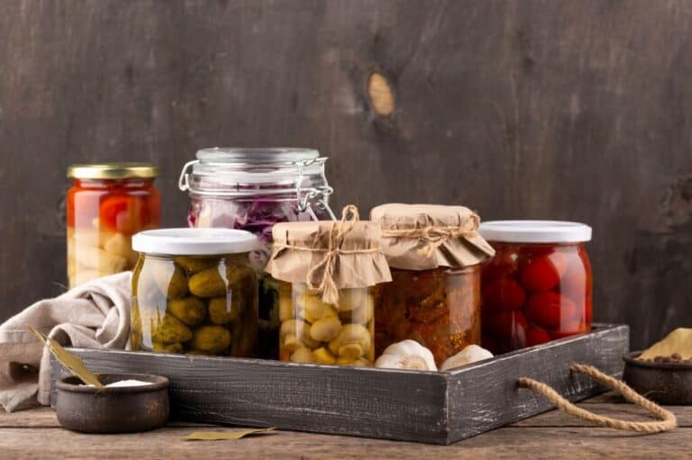 Jars with preserved food assortment.