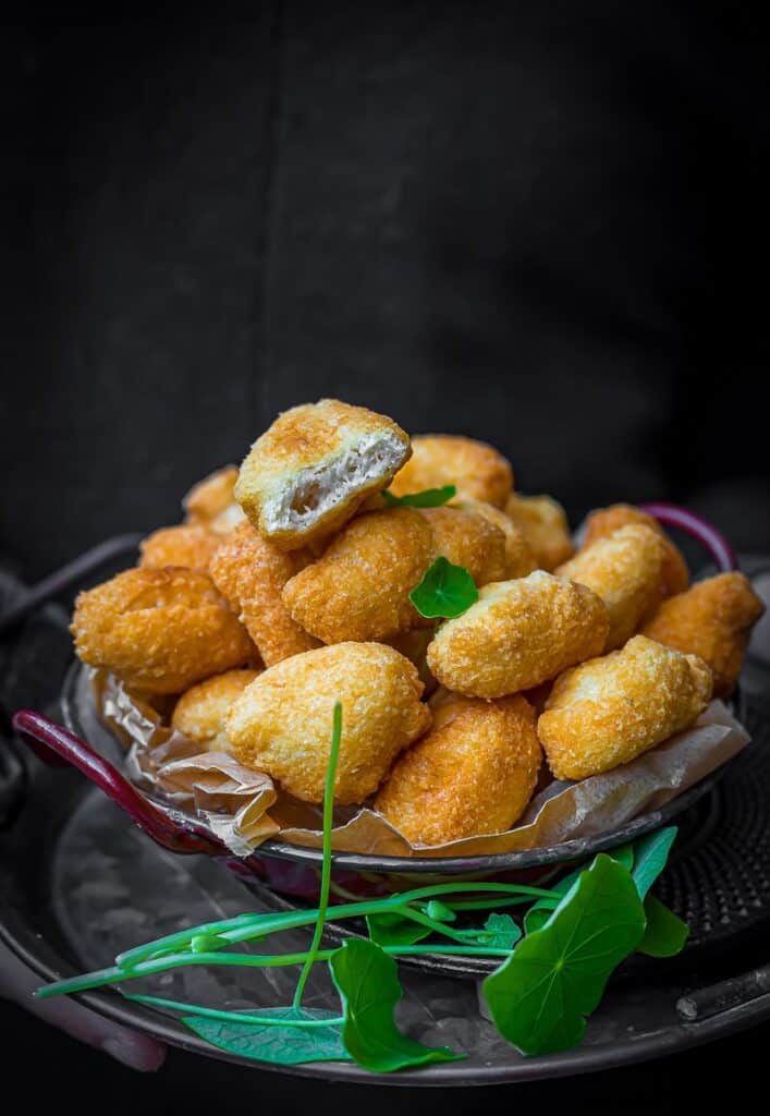 Loaded Tater Tots servce in a bowl.