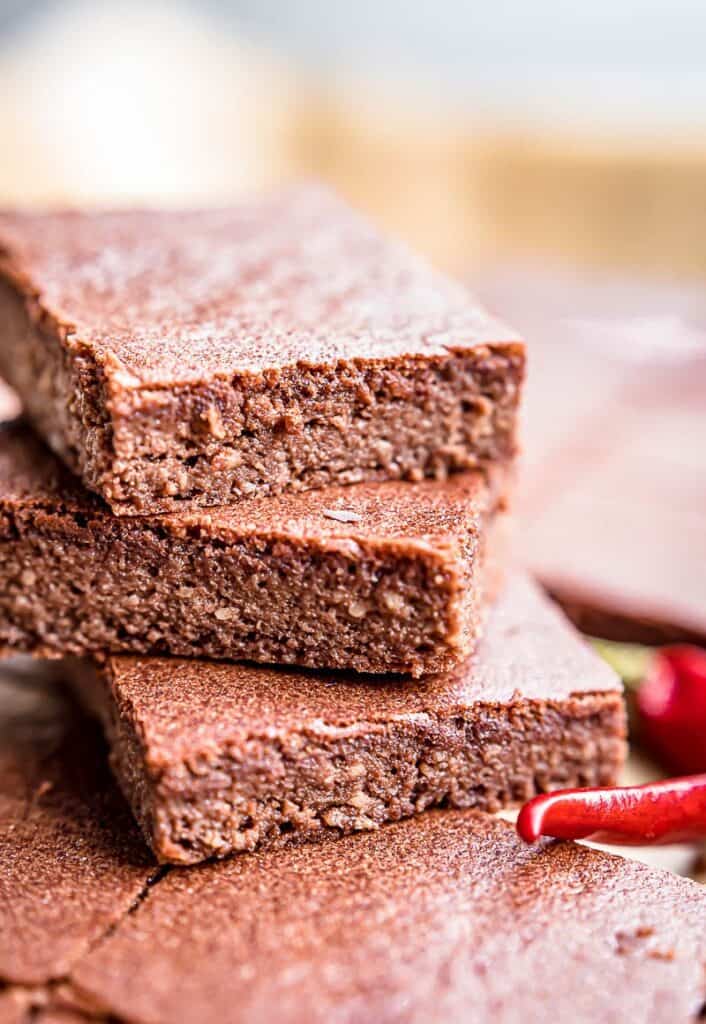 A plate of rich Southern spiced brownies with chili on top.