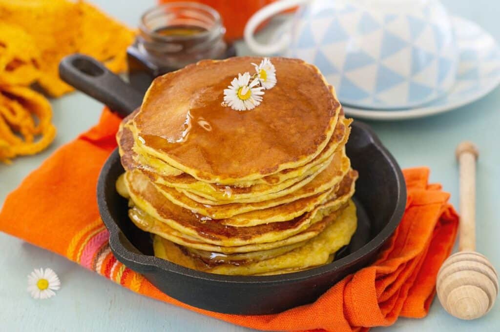 Traditional Southern Hoe Cakes (Johnny cakes) served with honey.