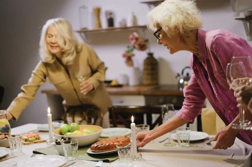 Women Preparing Foods on the Table.