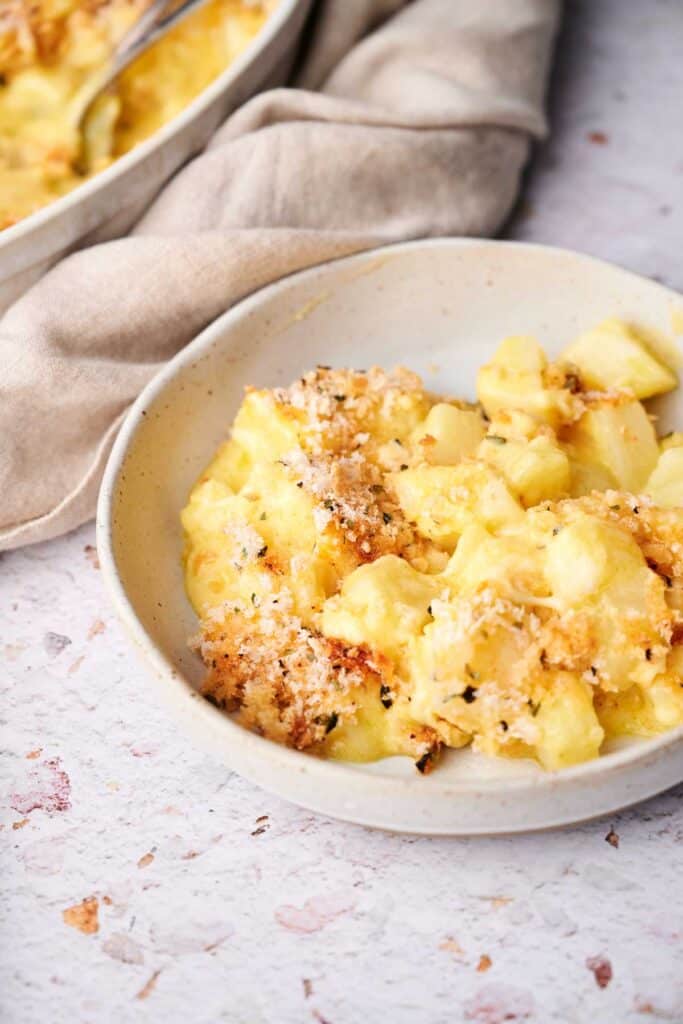 Cheesy baked funeral potatoes ready to serve.