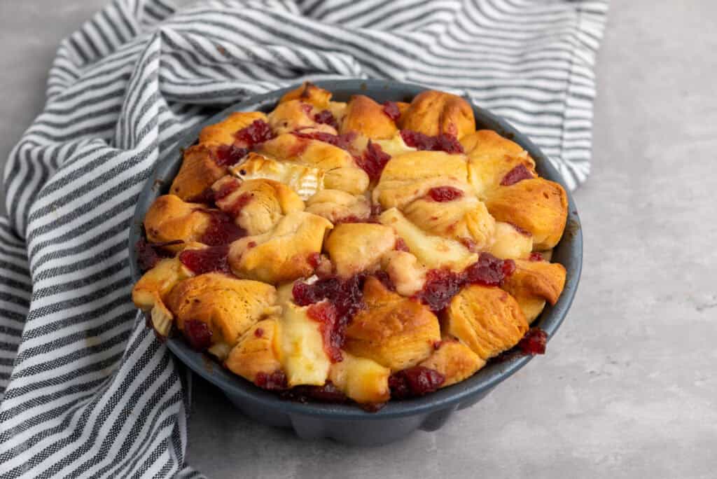 Mini cranberry Brie pull-apart bread on a serving plate.