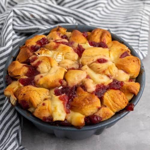 Mini cranberry Brie pull-apart bread on a serving plate.