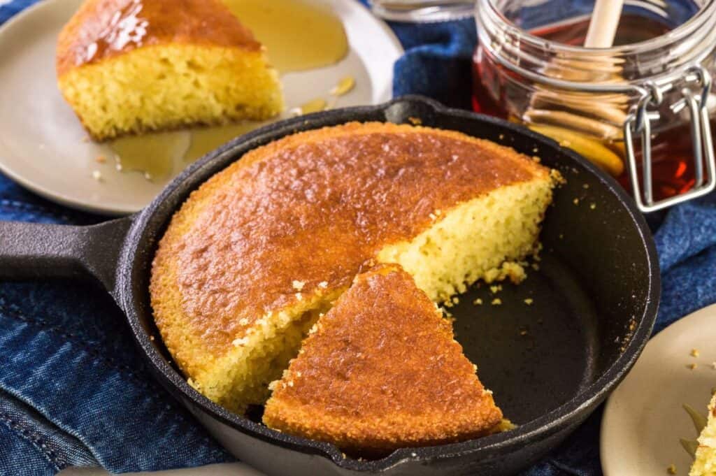 Organic sweet cornbread baked in cast iron pan.