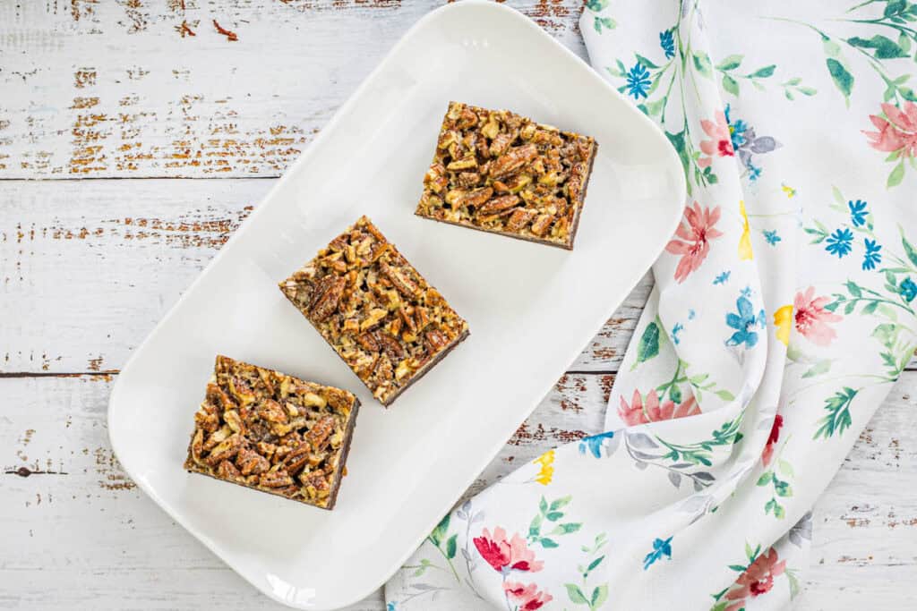 Sliced Pecan Pie Brownies on a plate