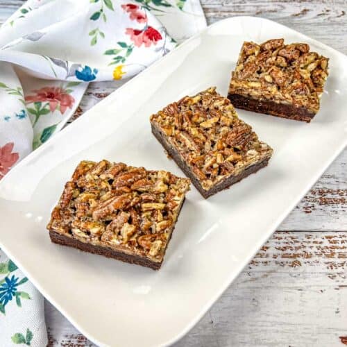 Sliced Pecan Pie Brownies on a plate.