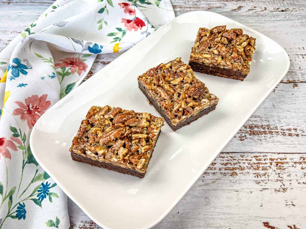 Sliced Pecan Pie Brownies on a plate.