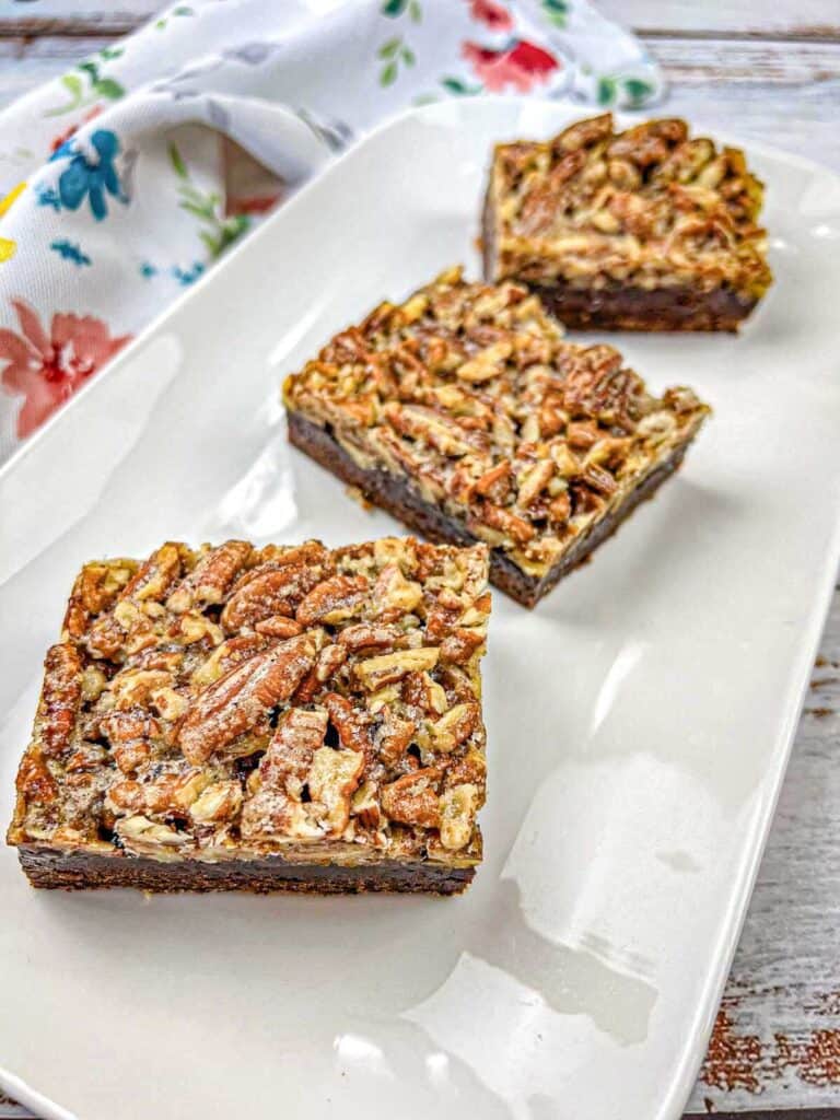 Close-up of pecans on top of freshly baked Pecan Pie Brownies.