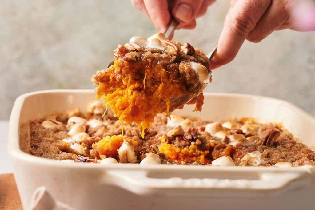 Warm and comforting sweet potato casserole served in a dish.