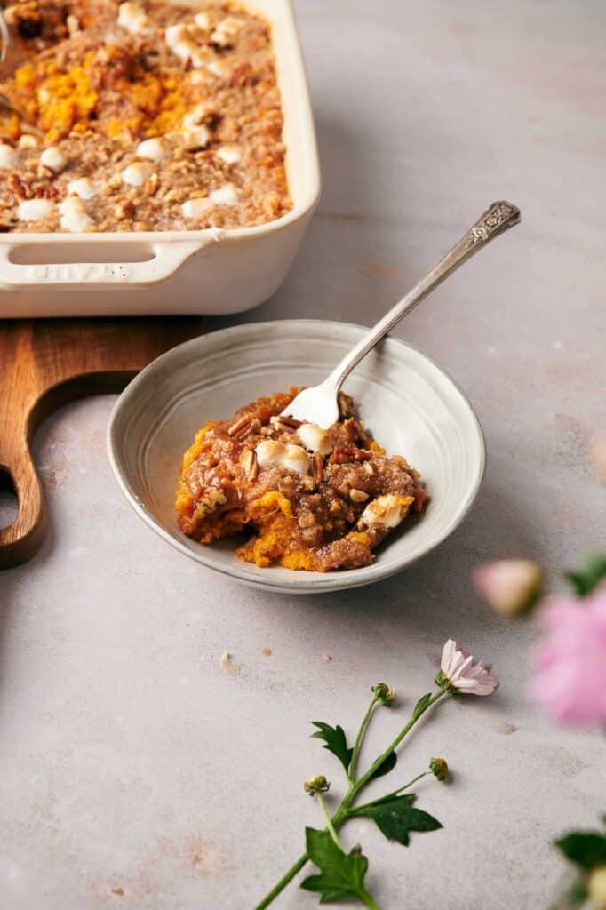 Warm and comforting sweet potato casserole served in a dish.