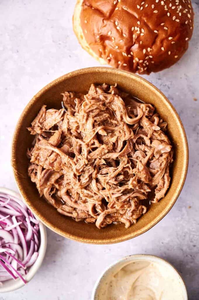 Bowl of slow-cooked pulled pork.