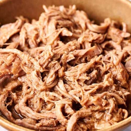 Tender pulled pork in a bowl.