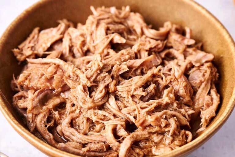 Tender pulled pork in a bowl.