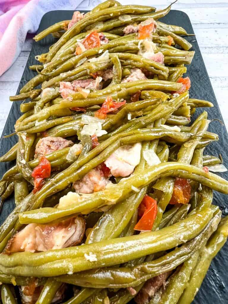 Slow-cooked Southern green beans with tomatoes and bacon.