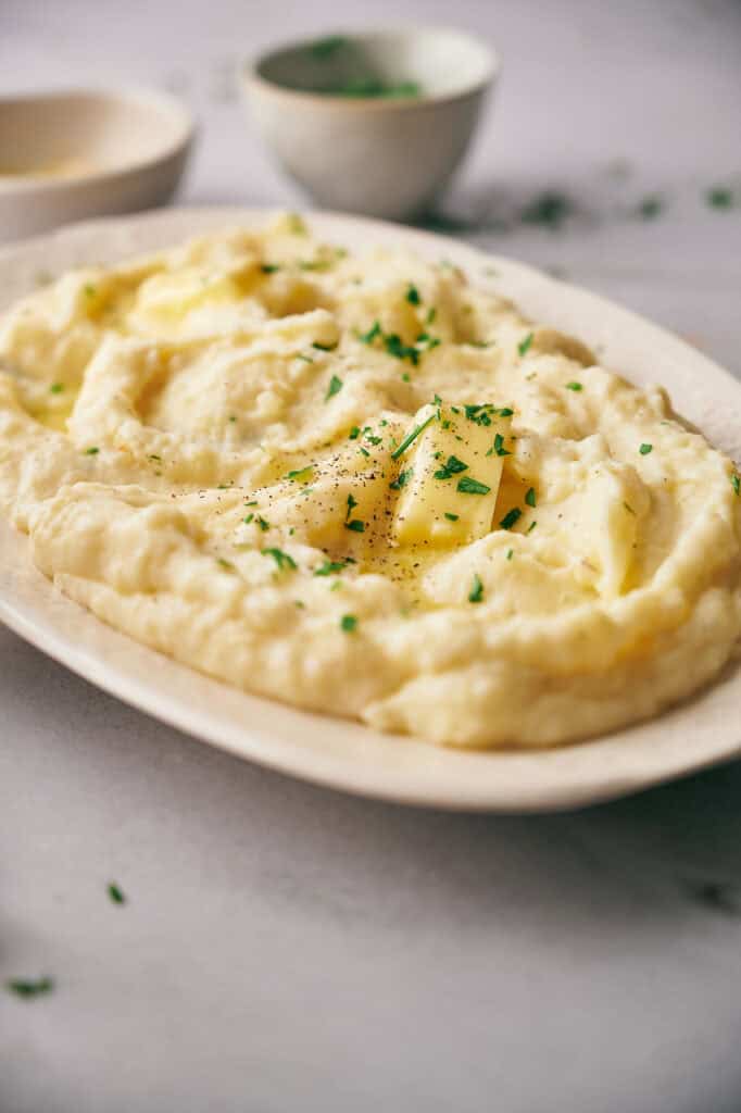 Creamy mashed potatoes with butter and parsley.