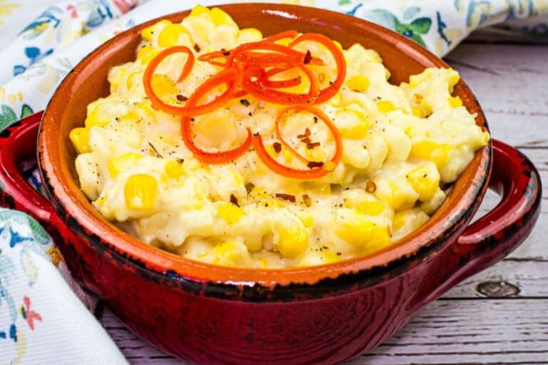 A close-up of smooth creamed corn with a creamy texture.