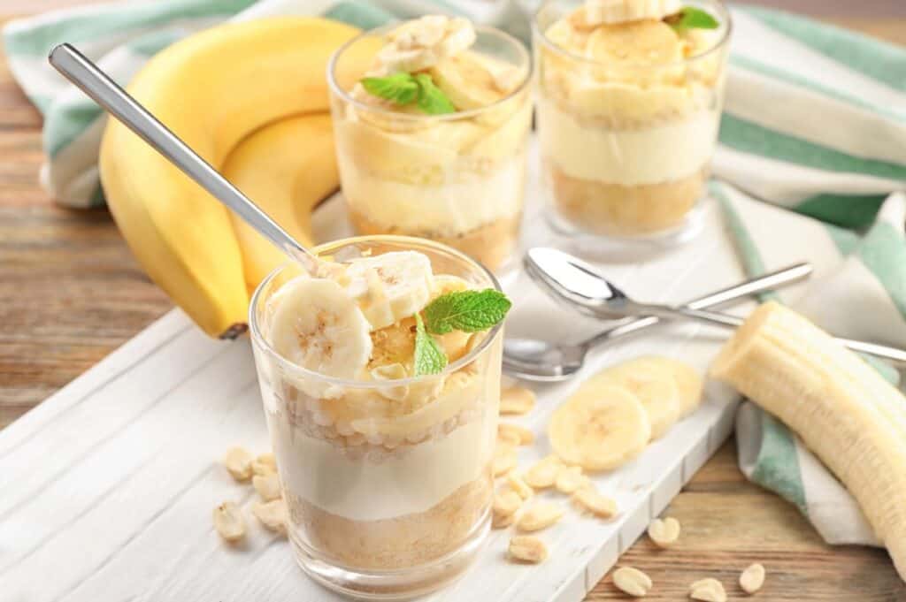 A bowl of creamy banana pudding layered with fresh banana slices.