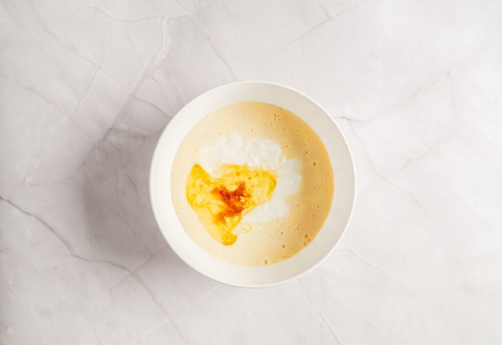 All of the rest of the wet ingredients are in the bowl of the zest-sugar mixture with eggs.