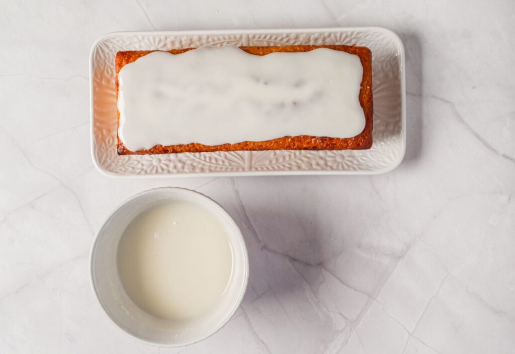 Cooled cake with glaze on top of it.