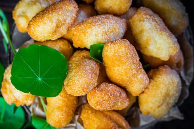 Freshly baked loaded tater tots in a cast iron skillet.