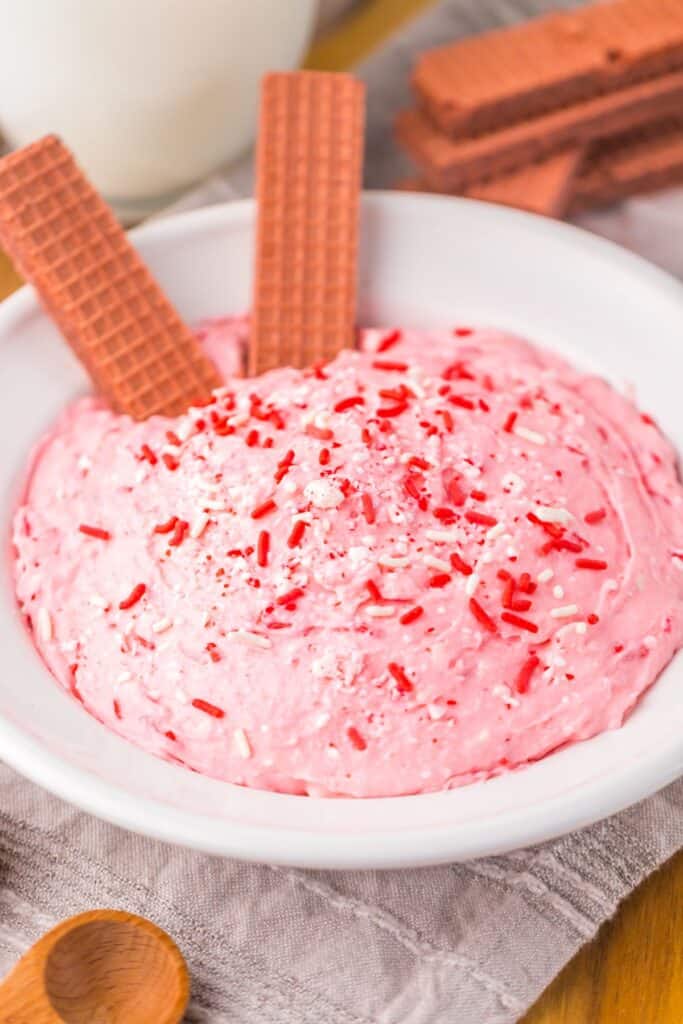 Close-up of peppermint fluff with red wafer sticks.