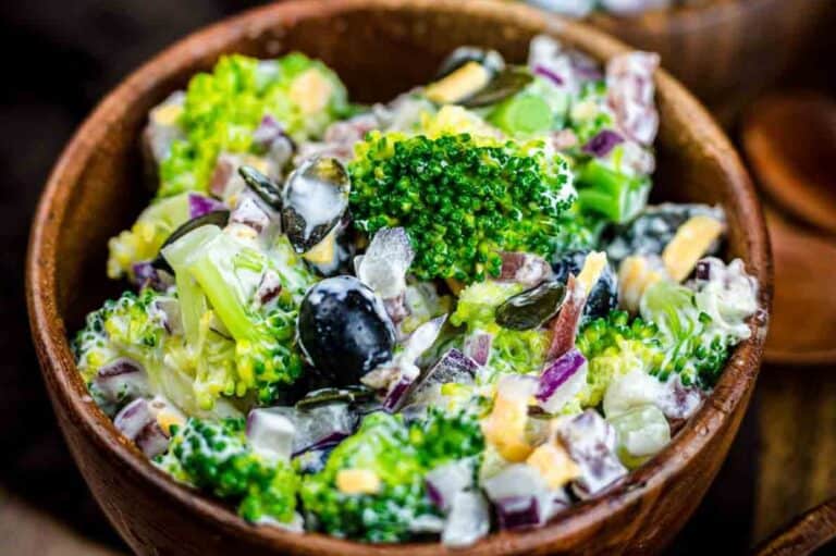 A healthy Southern-style broccoli salad with a mix of broccoli, cheese, bacon, and blueberries.