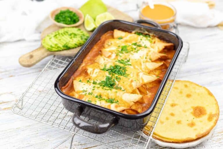 A pan of baked chicken enchiladas casserole.