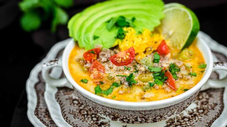 Creamy Keto Taco Soup with fresh avocado slices and lime.