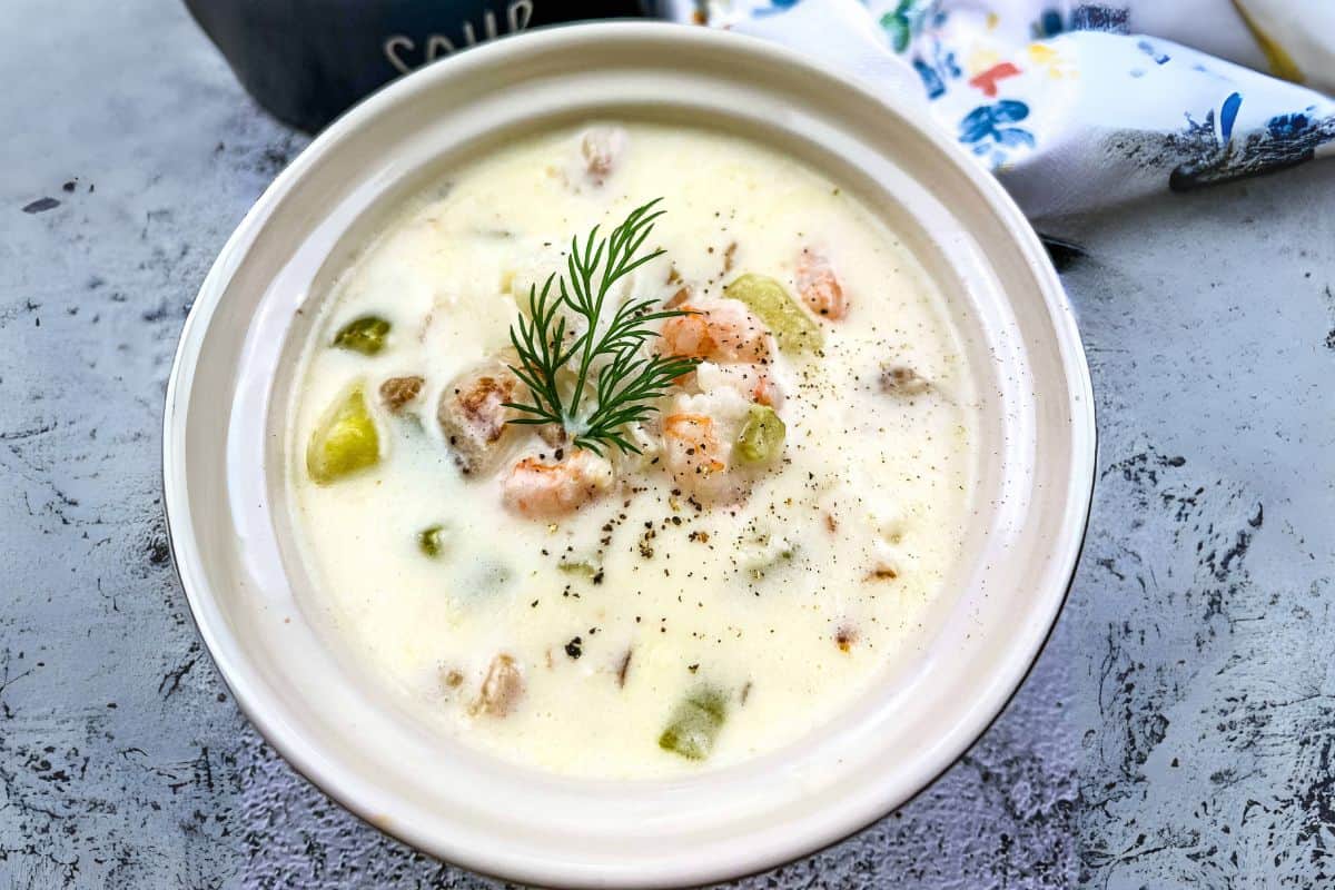 Seafood chowder with a sprig of dill, a delicious stew recipe.