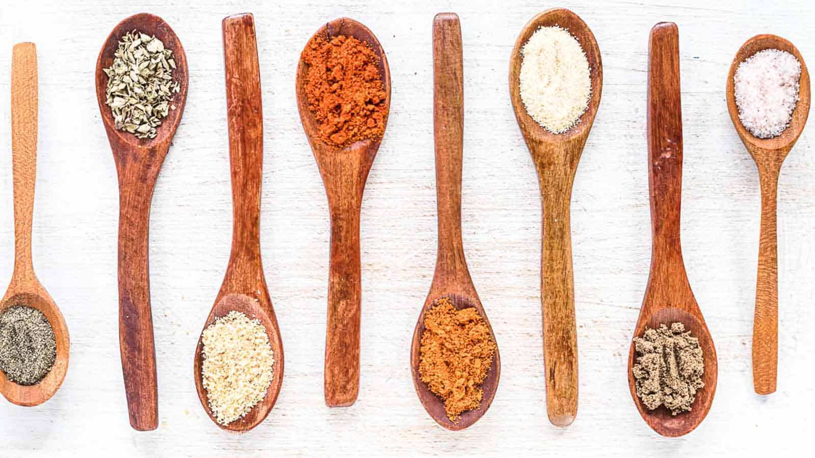 Gluten Free Taco Seasoning spices on a wooden spoons.