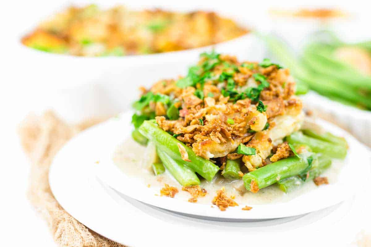 A plate of green bean mushroom casserole with fried onions.