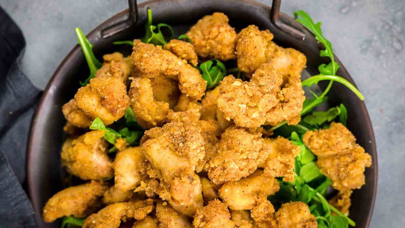 A bowl of golden-brown fried chicken pieces.