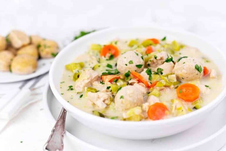 A bowl of homemade chicken soup with dumplings.