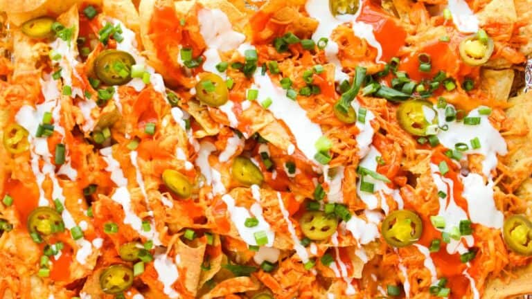 Loaded Buffalo Chicken Nachos on a platter.