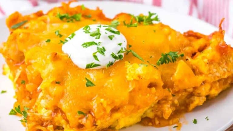 Chicken Tamale Pie garnished with chopped herbs on a white plate.