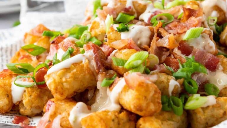 Loaded Tater Tots on a platter.