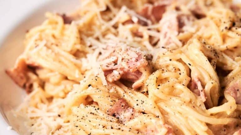 Pasta Carbonara with grated cheese and freshly ground black pepper.