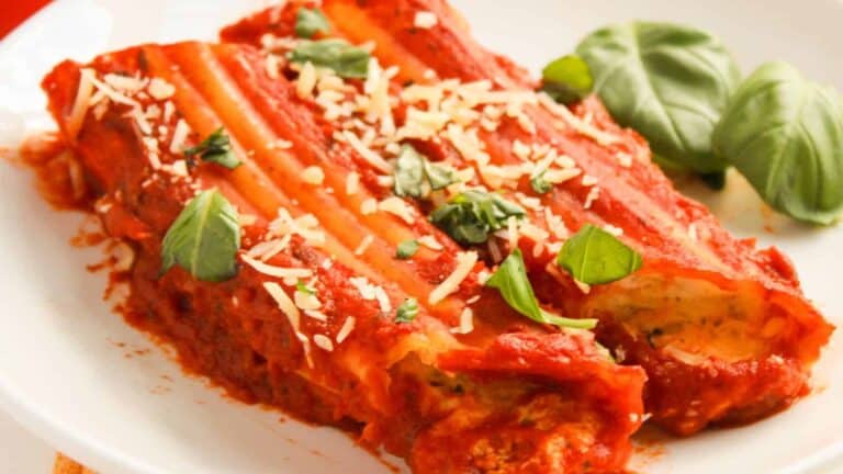 Three Cheese Manicotti on a white plate.