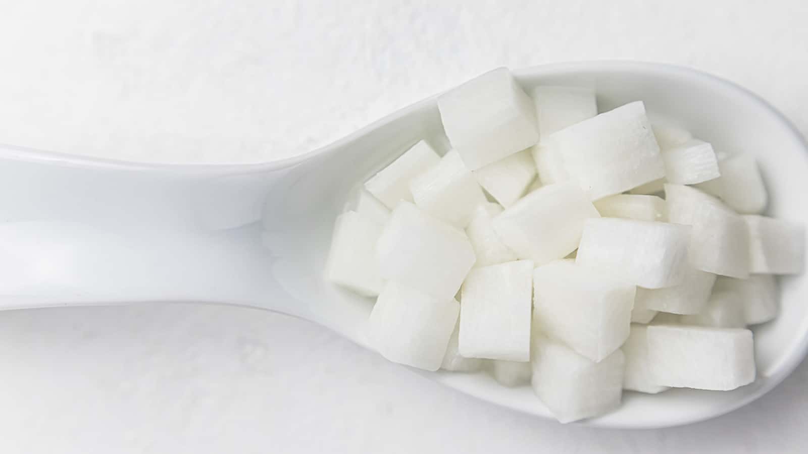 Pickled Daikon Radish inside white plate.