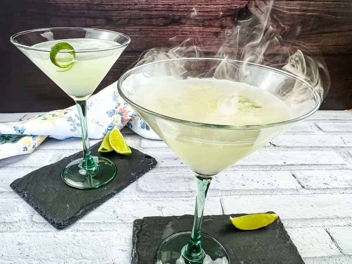 Two lime gimlets with smoke on top.