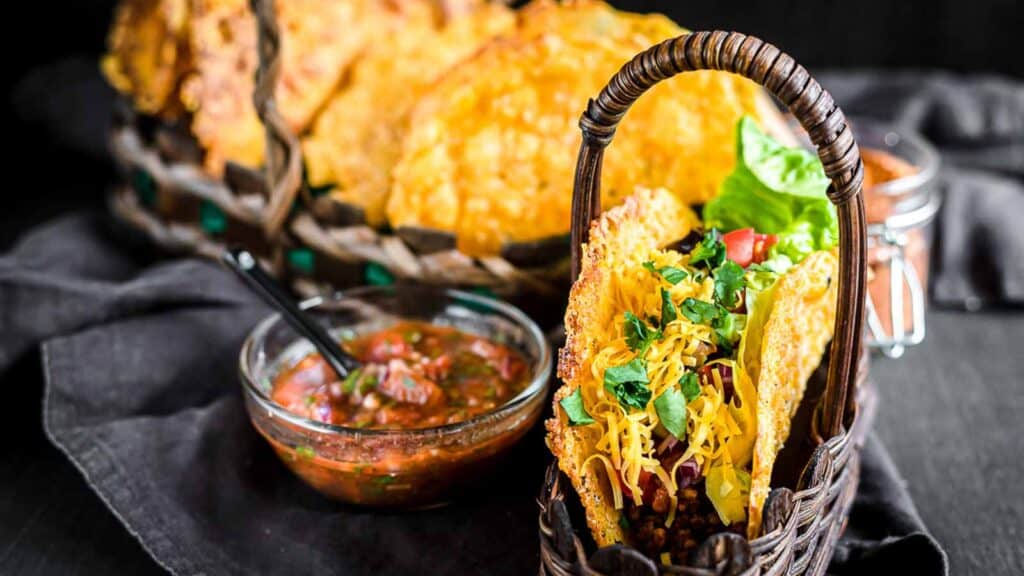 Tacos in a brown basket.
