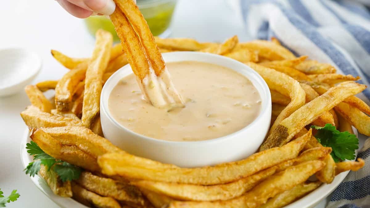 Copycat Animal Sauce in a bowl with fries around it.