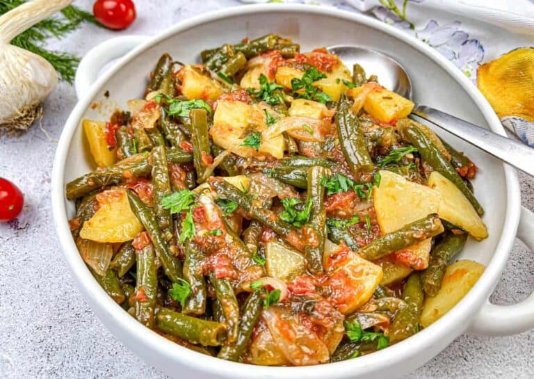 Greek Green Beans served in a white bowl.