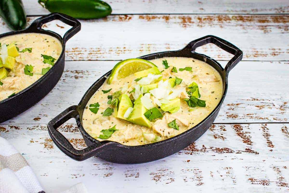 Two cast iron bowls filled with White Chicken Chili.