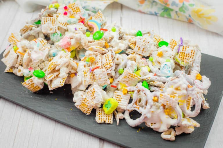 A slate tray of Leprechaun Bait beside a napkin on a wooden surface.